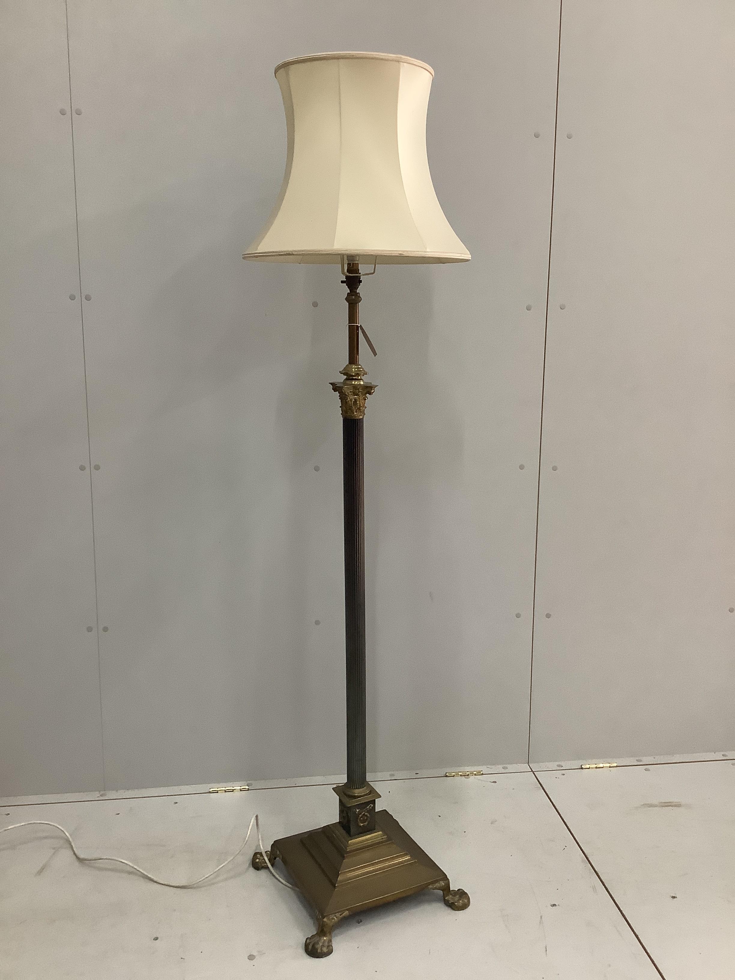An Edwardian Corinthian column brass telescopic standard lamp